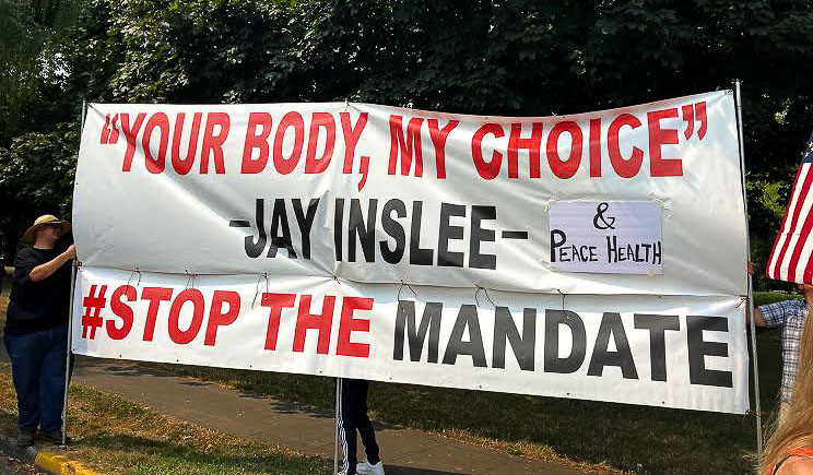 Citizens protest in Vancouver against the Gov. Jay Inslee mandate, and PeaceHealth’s decision that all their workers get the vaccination. Yesterday PeaceHealth put employees that had not complied on unpaid leave. Photo courtesy of Jessica Wilkinson