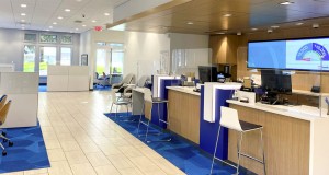 The new branch experience includes bankers equipped with mobile tablets to help customers throughout the many spaces of the branch, including customer support stations that provide space for one-on-one conversations and replace the common teller lines. Photo courtesy U.S. Bank