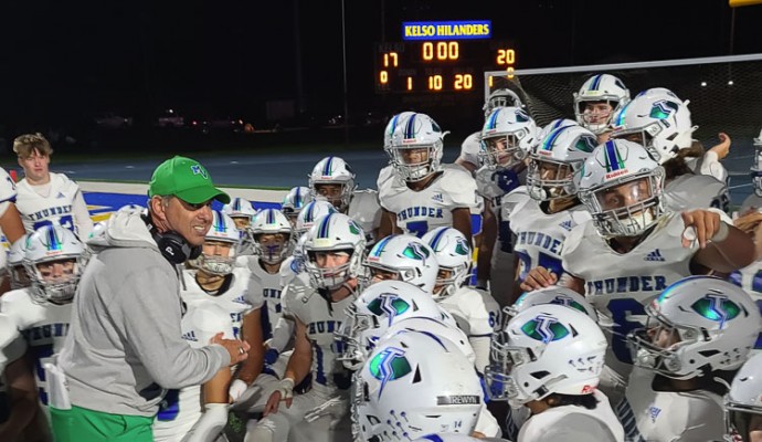 Mountain View coach Adam Mathieson talks to his players after the Thunder’s 20-17 win at Kelso on Friday. Photo by Paul Valencia