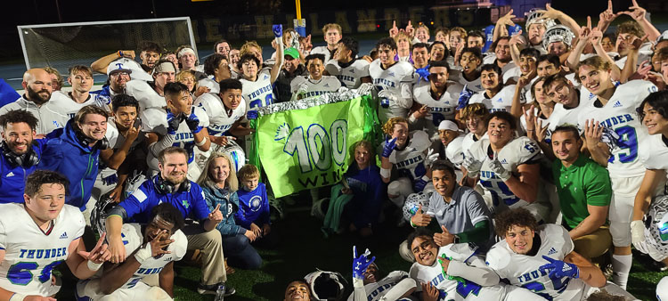 Mountain View football coach Adam Mathieson is somewhere in there, celebrating with his team after Friday’s 20-17 win over Kelso. It was Mathieson’s 100th win as a head coach. Photo by Paul Valencia