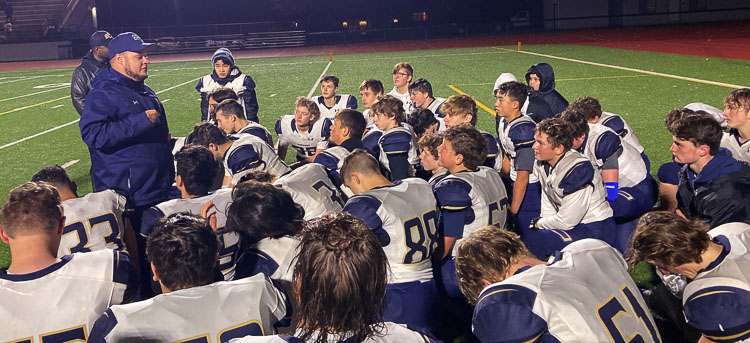 Seton Catholic coach Dennis Herling addresses his team after the Cougars lost in their first playoff game in program history Thursday night. Photo courtesy Bryan Levesque