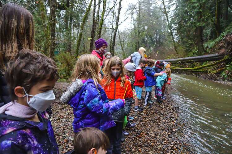 Second graders preparing for the moment when their salmon fingerlings would be released into the cold, flowing waters at Gee Creek. Photo courtesy Ridgefield School District