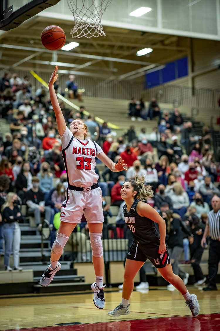 Addison Harris skies high toward the rim earlier this season. A sophomore, Addison hopes to play college basketball, just like her mom, Battle Ground graduate Carla Idsinga Harris. Photo courtesy Heather Tianen