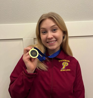 Prairie senior Lilly Bash shows off her medal for winning the Class 3A state high school bowling championship. Photo courtesy Bash family