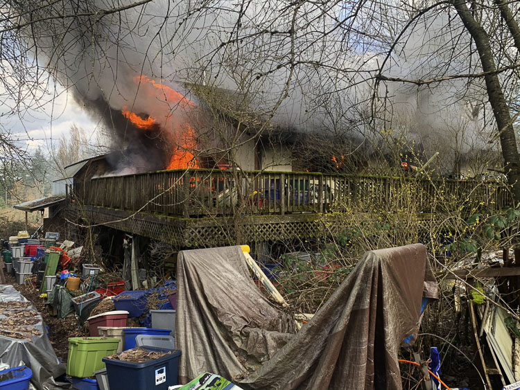 The house was heavily engulfed with fire. Photo courtesy Clark-Cowlitz Fire Rescue