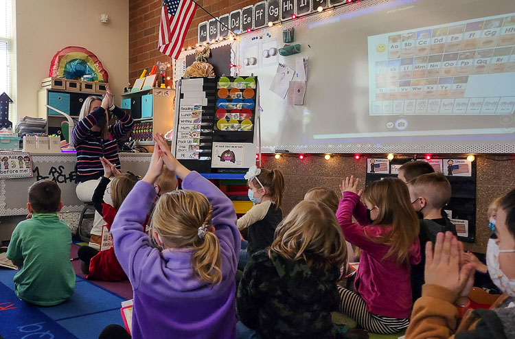 Kindergarten students make a game of learning how to spell simple words in Melinda Beachell's class at Tukes Valley Primary School. Photo courtesy Battle Ground School District