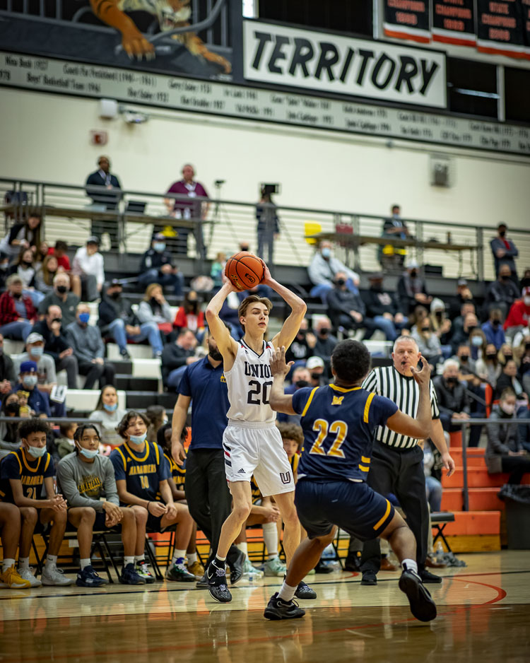 Porter Hill kept working, building the strength to become a key varsity basketball player at Union High School. A senior, Hill has the school record for taking the most charges. Photo by Heather Tianen