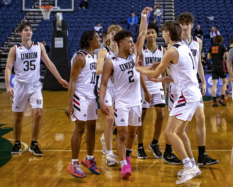 The Union Titans celebrate Thursday’s night’s quarterfinal win. The Titans will take on Curtis on Friday in the state semifinals. Photo by Heather Tianen