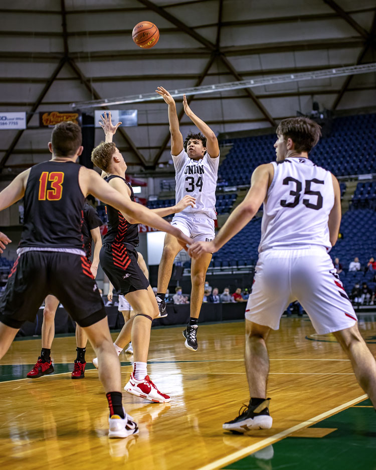 Yanni Fassillis hits this fadeaway, two of his 21 points for the Union Titans on Thursday. Union defeated Kamiakin in the state quarterfinals. Photo by Heather Tianen