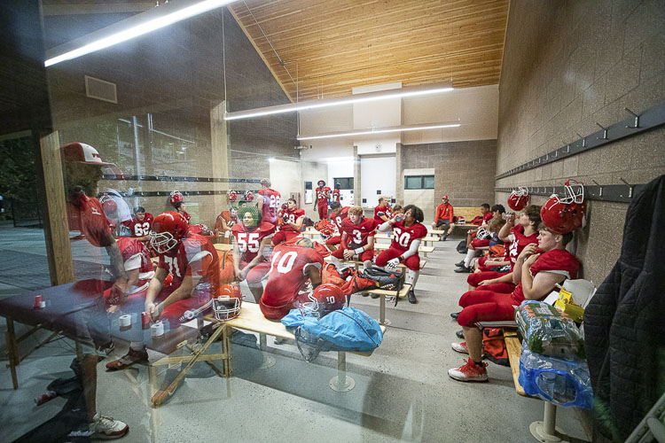 The Fort Vancouver Trappers gathered to meet just prior to taking on St. Helens at Kiggins Bowl on Friday night. Photo by Mike Schultz