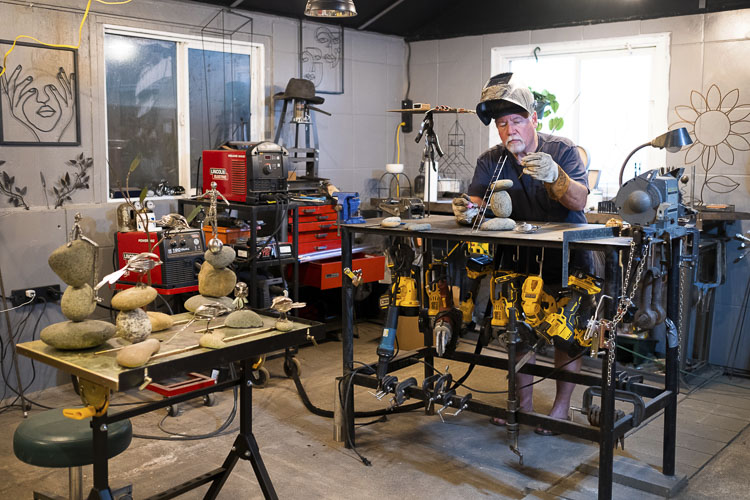 Artist Larry Holt in his welding studio. Photo courtesy artstra.org