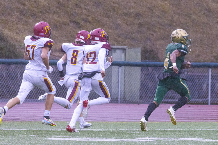 Jonathan Landry says so long to the Prairie special teams unit on his way to an 85-yard kickoff return for an Evergreen touchdown. Photo by Mike Schultz