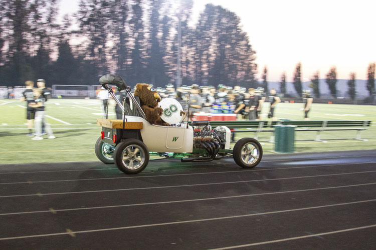 CTE Teacher Wayne Miller drove the Beaver mascot around in a classic roadster built and maintained by students taking auto mechanics classes. Photo courtesy Woodland School District