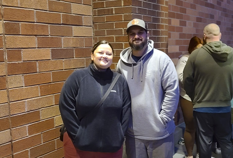 Jessica and Kyle Wasch kept a tradition going on Friday morning. Jessica said she wasn’t sure she wanted to go Black Friday shopping but then remembered it is now her tradition to brave the crowds and get in line. Photo by Paul Valencia