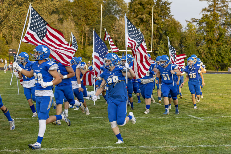 Happy Veterans Day from the La Center Wildcats, who will bring their passion to Woodland High School on Friday night in the opening round of the Class 1A state football playoffs. La Center is “hosting” Cashmere, using Woodland as its home stadium this week. Photo by Mike Schultz