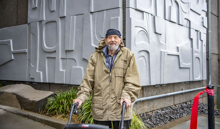 James Lee Hansen with art in background. Photo courtesy city of Vancouver