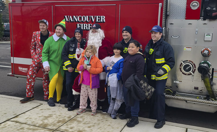 Children from Marshall Elementary School in Vancouver got to pick a new coat and got a tour of a fire engine, courtesy of Vancouver Fire Department and IAFF Local 452. Photo by Paul Valencia