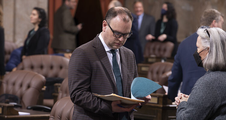 Rep. Greg Cheney, R-Battle Ground, looks over proposed legislation on the House floor. Photo courtesy House of Representatives