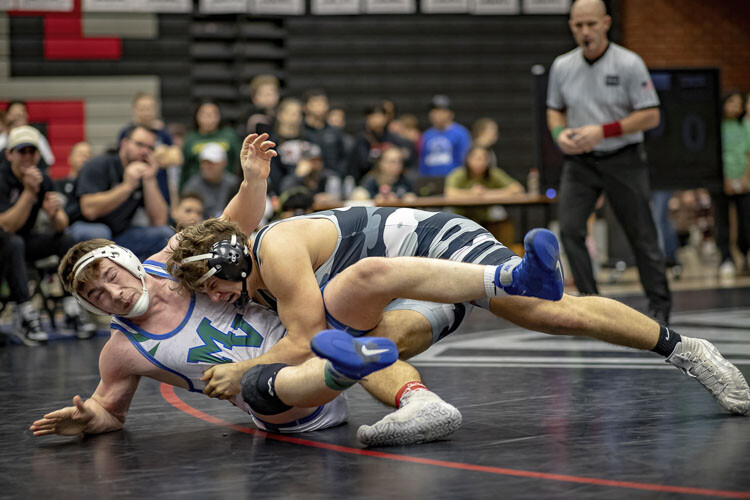 Clayton Maus of Union takes down Ayden Denbo of Mountain View in the 220-pound championship match Saturday at the Clark County Championships. Maus would go on to win. Photo courtesy Heather Tianen