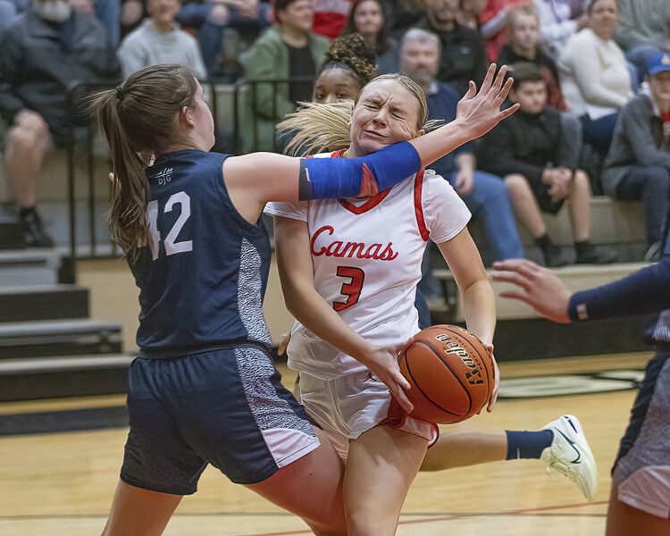 Riley Sanz and the Camas Papermakers survived a defensive battle Friday night, beating Bellarmine. Sanz would hit the clinching basket, beating the shot-clock buzzer to swish a 3-pointer with 20 seconds left, giving Camas a four-point lead. Photo by Mike Schultz
