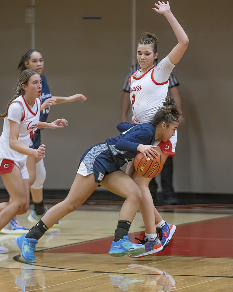 Kendall Mairs was pretty much a brick wall on defense Friday night for the Camas Papermakers. Nobody was getting past her. Mairs blocked shots, took charges, and picked up steals all night. Photo by Mike Schultz