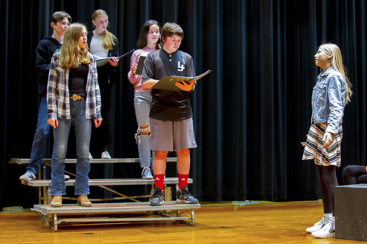Lillia Andrews, an eighth grader (far right), enjoys the social camaraderie that comes from performing with friends. Photo courtesy Woodland School District