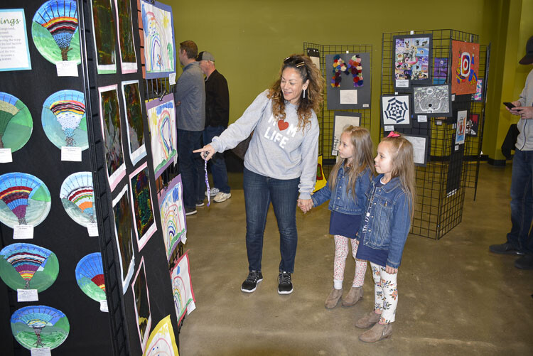Families check out artwork by local students at the Washougal Youth Arts Month Gallery. Photo courtesy Washougal School District
