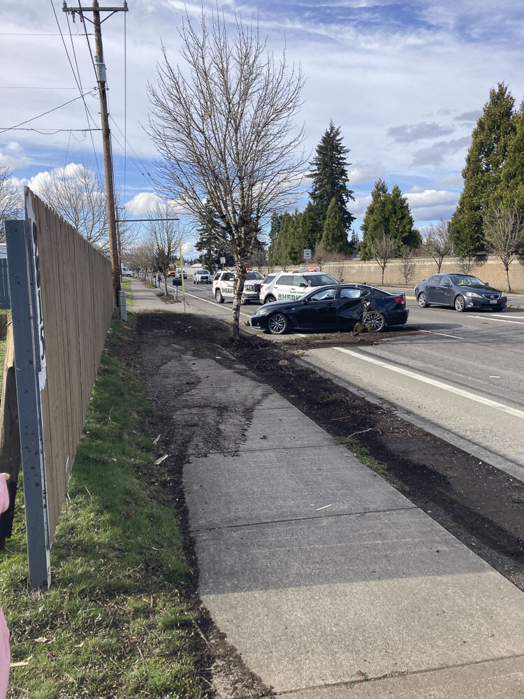 On March 14 at about 3:40 p.m., a stolen black Lexus crashed into a mailbox and tree at NE Covington Road at NE 73rd Street. Photo courtesy Clark County Sheriff’s Office
