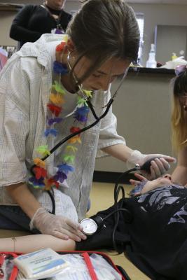 Kloe Leonard practices using a stethoscope and Automated External Defibrillator (AED) in Sports Medicine class at Washougal High School. This was one stop on the AASA site tour at Washougal High School. Photo courtesy Washougal School District