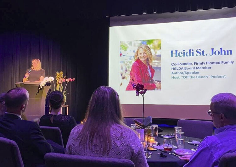 A fundraising dinner was held on Saturday evening (April 15), to help secure a new building for the Firmly Planted Homeschool Resource Center (FPHRC) at the business’s current location. Owner Heidi St. John is shown here addressing the gathering. Photo courtesy Leah Anaya