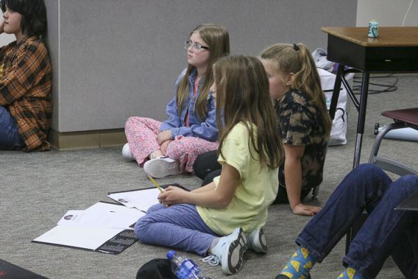 Middle school students study their scripts. Photo courtesy Washougal School District