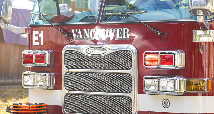 Explosions and a fire destroy vehicles and damage a home in Vancouver, leaving two dogs dead and prompting an investigation by the Vancouver Fire Marshal's office.