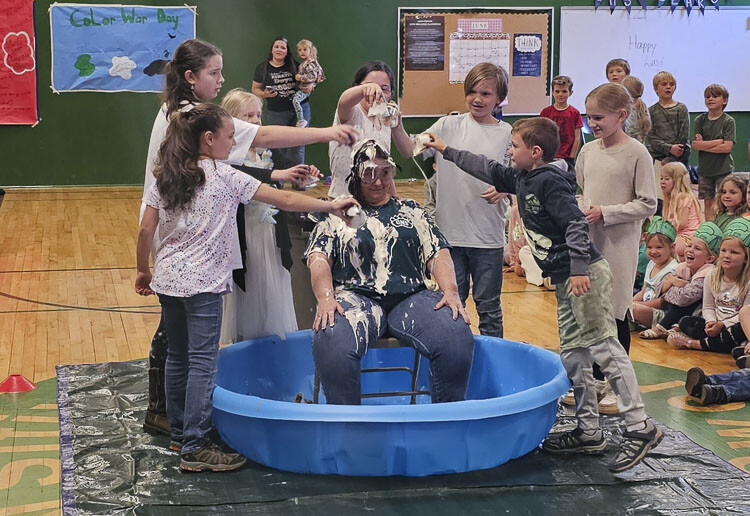 Green Mountain School students got the chance to turn their principal into an ice cream sundae on the final day of school Wednesday. Photo by Paul Valencia