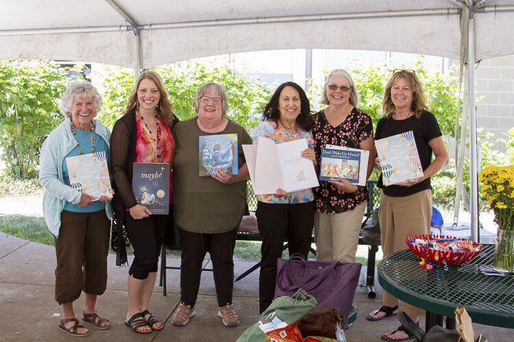 Kindergarten and 1st grade teachers who taught the Class of 2023 reuniting with their students one last time. Photo courtesy Woodland School District