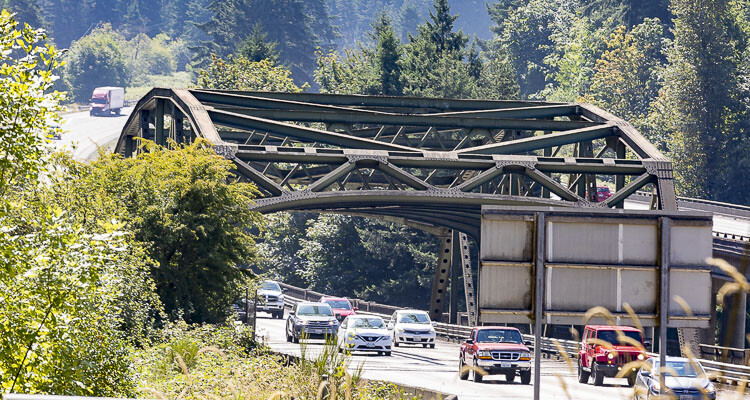 Travelers should expect up to 12 hours of delays on northbound Interstate 5 near La Center due to the closure of a lane for bridge maintenance, prompting the need for off-peak travel and caution from drivers.