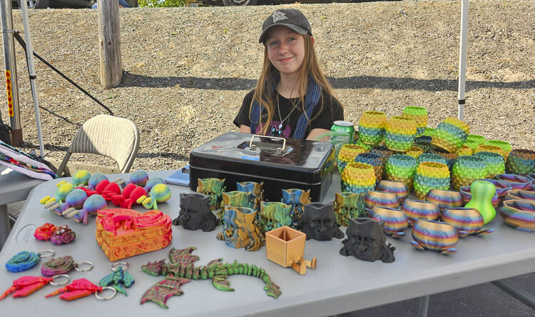 Abby Fich is an artist who sells her crafts at the La Center Farmer’s Market. Proceeds from the market go to The Loft, “a place for teens” to gather in La Center. Just so happens Fich is a regular member of The Loft, too. Photo by Paul Valencia
