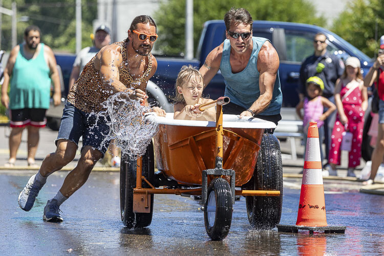 Phillip, C.J. and Chris Rainford made up the Shower Monkey Team in the Camas Days bathtub races. Photo by Mike Schultz