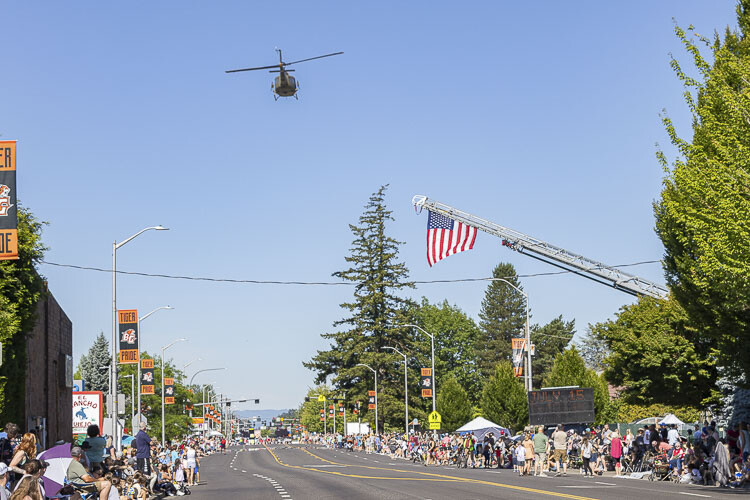 A Huey helicopter flew over Main Street in Battle Ground prior to Saturday’s Harvest Days Parade. Photo by Mike Schultz