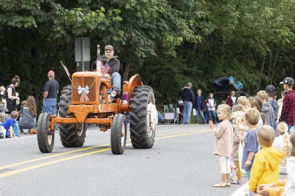 Josh Ostrand was one of those who rode a tractor in this year’s parade. Photo by Mike Schultz