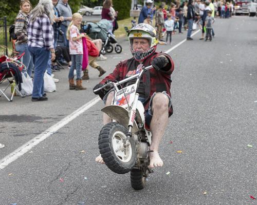 Mike Harelson prefers bare feet when he does wheelies on his motorcycle. Photo by Mike Schultz