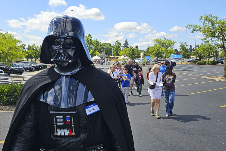 An interesting sight on Tuesday as Darth Vader led children, and their volunteer shopping buddies, into Walmart for a shopping spree. Photo by Paul Valencia