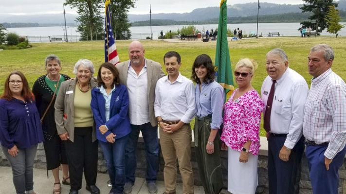 Washougal city officials pose with DOT Secretary Pete Buttigieg, Senator Maria Cantwell, and Congresswoman Marie Gluesenkamp Perez during ceremonies at the Port of Camas-Washougal. Photo courtesy of John Ley