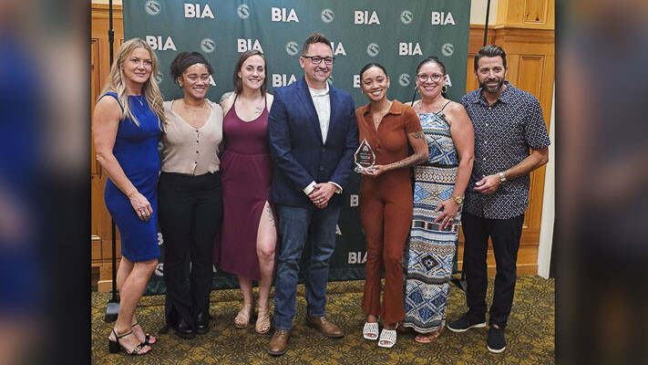 Members of Blaze Restoration posed with BIA members Thursday night after winning one of two Building Excellence Awards presented by the Building Industry Association of Clark County. Photo by Paul Valencia