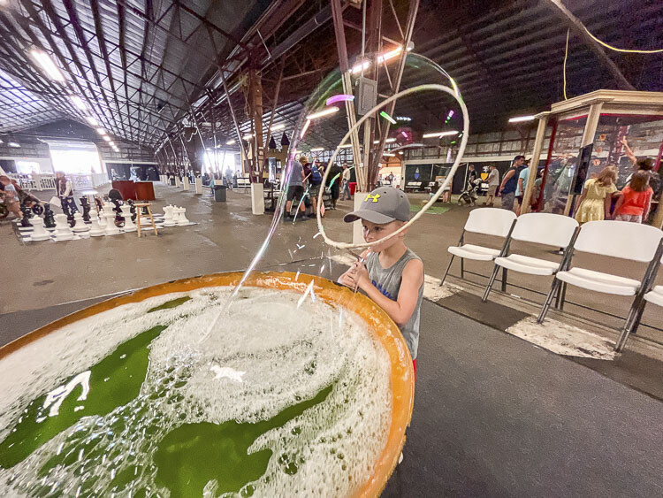 Hunter Krebser of Woodland enjoyed creating this big bubble in the Wizard’s Challenge at the Clark County Fair. The fair opened its 10-day run Friday. Photo by Mike Schultz