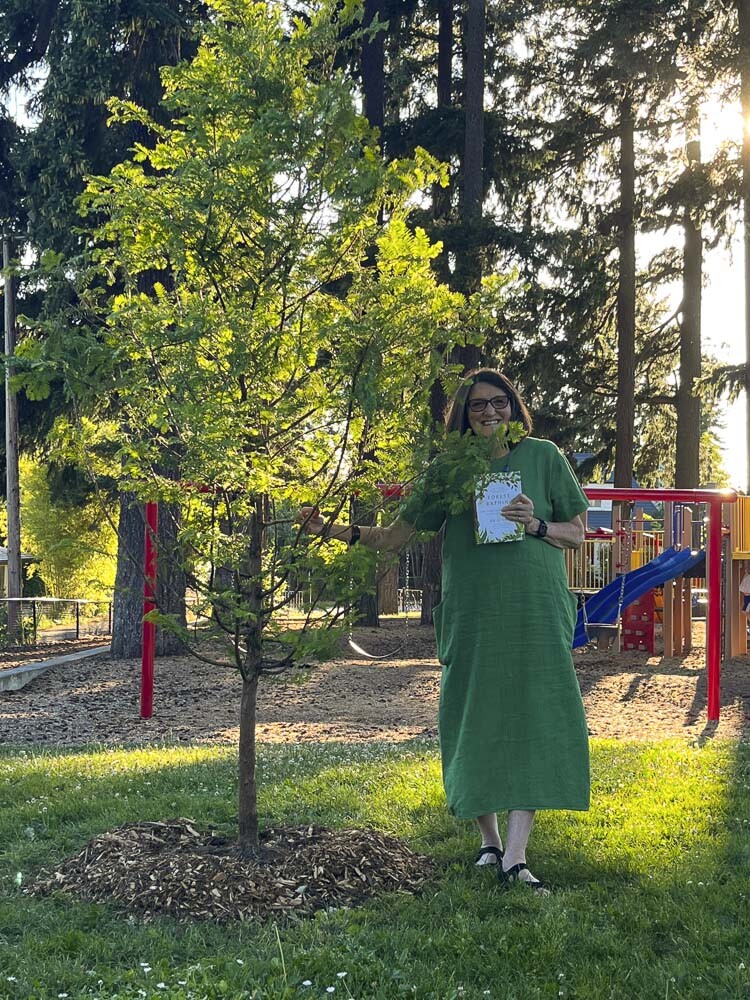 Susan Sanders is shown here next to Carter Park Witness Tree, Photo courtesy city of Vancouver