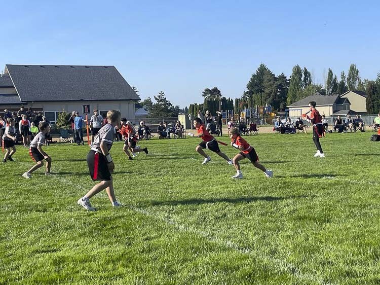 Filling three football fields for one-hour games for three straight hours, over two hundred kindergarten through eighth-grade flag football players and nearly eighty cheerleaders played and cheered their first games of the season Saturday. Photo courtesy Upward Sports volunteers