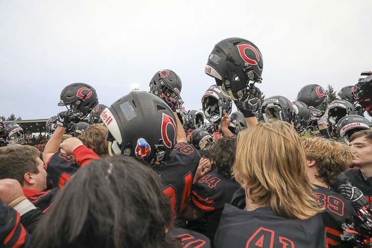 The Camas Papermakers have won two state championships since 2016. Here, they are shown celebrating their semifinal victory at McKenzie Stadium in 2019. Many of the players on the team competed with Clark County Youth Football when they were younger. Photo by Mike Schultz