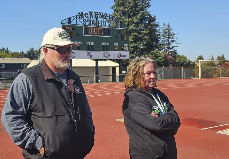Terry and Mary Hyde stand at McKenzie Stadium at a recent Clark County Youth Football game day. The Hydes have seen many of their youth football players move on to high school and excel. McKenzie Stadium has hosted state semifinal victories for Camas, Hockinson, and Union en route to state championships. Photo by Paul Valencia