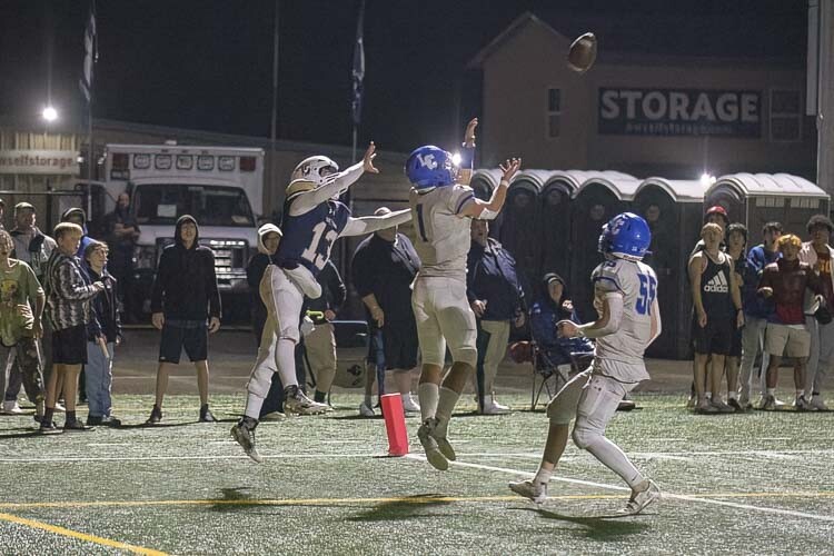 Houston Coyle makes the defensive play of the night for the La Center Wildcats, intercepting a pass in the end zone in the closing minutes of the game, preserving La Center 14-3 win over Seton Catholic. Photo by Mike Schultz