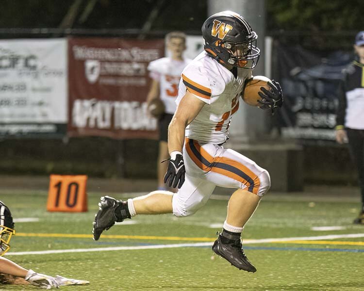 Mercy Johnston of Washougal had two rushing touchdowns Friday in a win over Hudson’s Bay. Photo by Mike Schultz